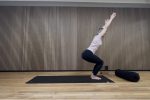 Doing chair yoga pose in a yoga studio