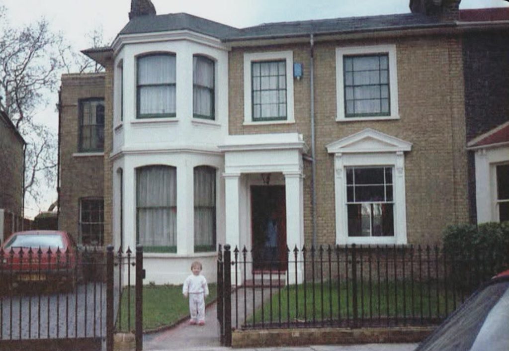 Child in front of family home. Tessa Spring: working with you to keep moving through life shifts