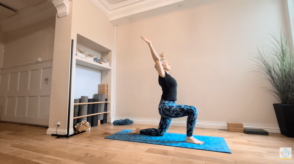 Low lunge with arms raised