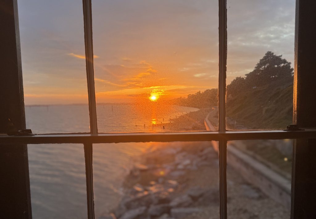 Sunset viewed through home window